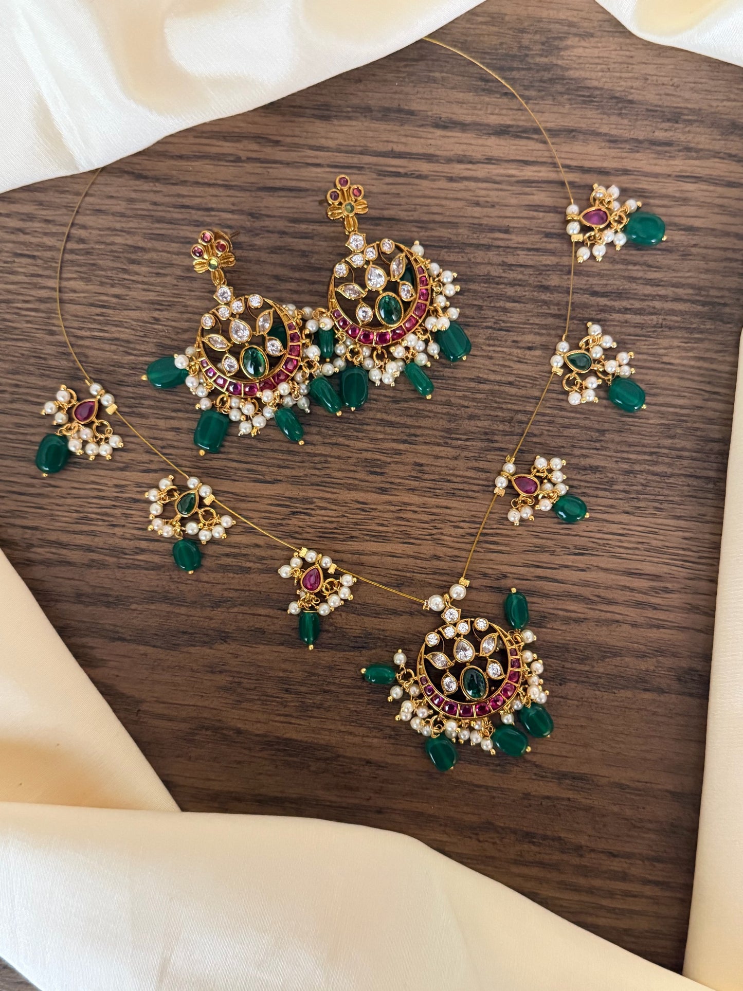 Majestic Chandbali Motif Invisible Chain Necklace Set with Emerald Beads