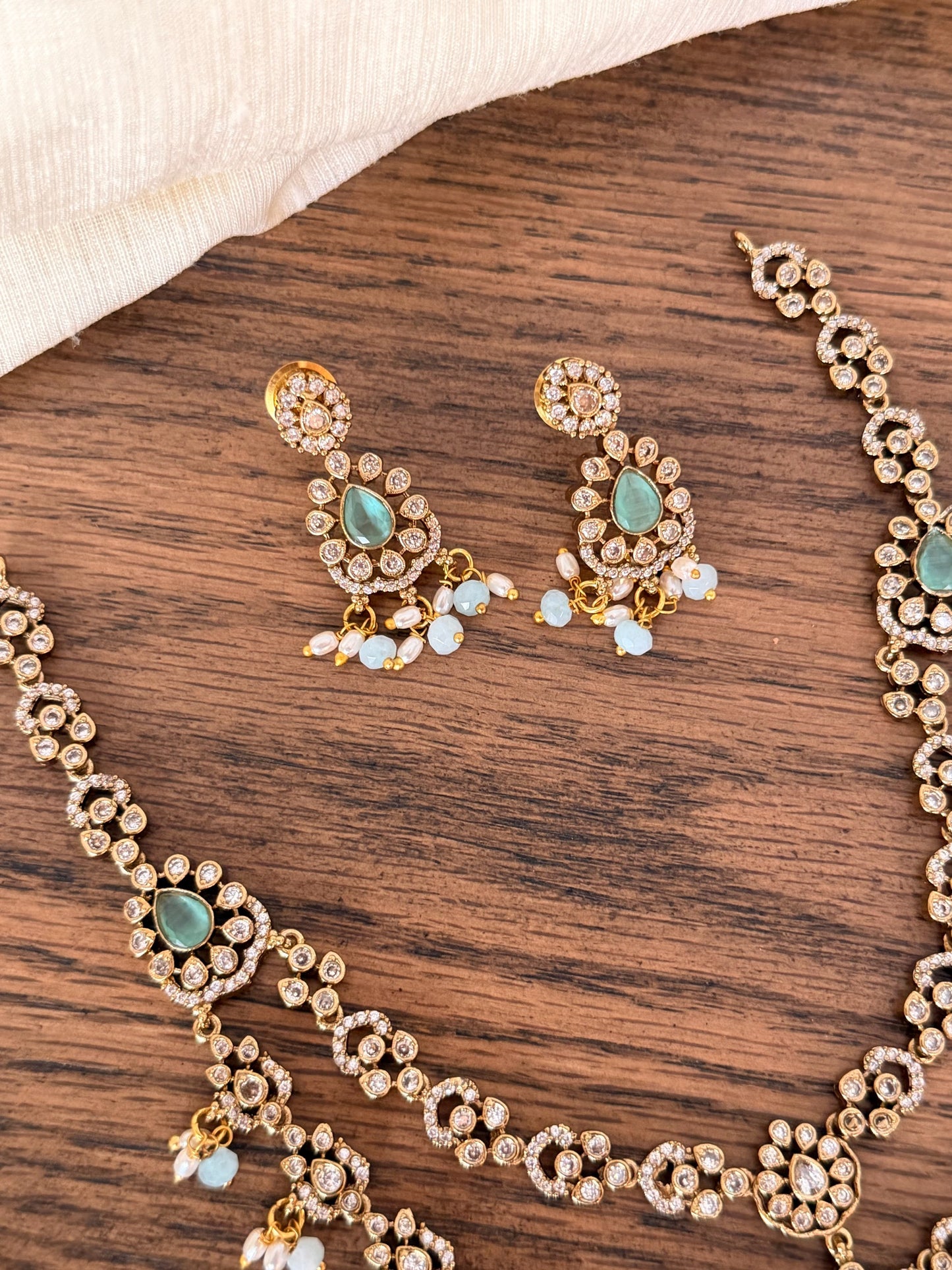 Exquisite Double-Layered CZ & Emerald Necklace with Seed Pearl Tassels