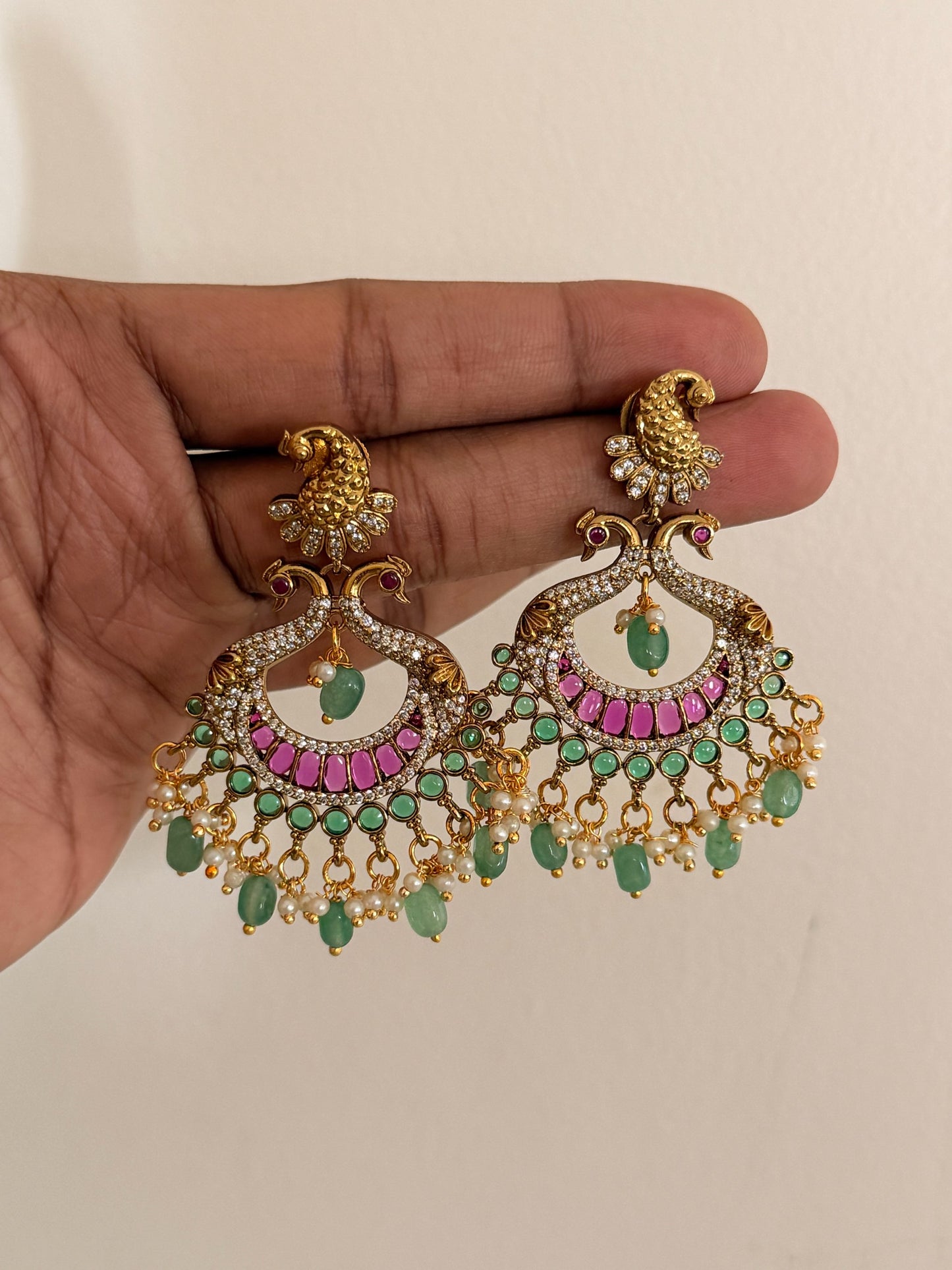 Elegant Peacock Kemp Stone Chaandbali Earrings with Pearl & Green Beads