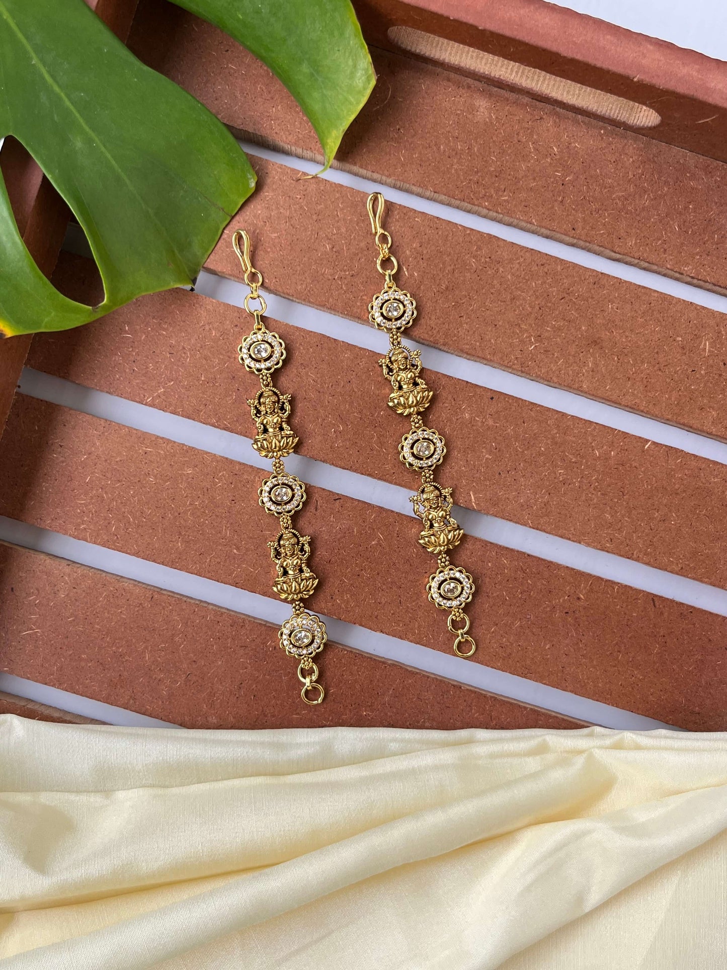 Lakshmi Devi Studded Mattal with Emerald Green Stones – Unique Design