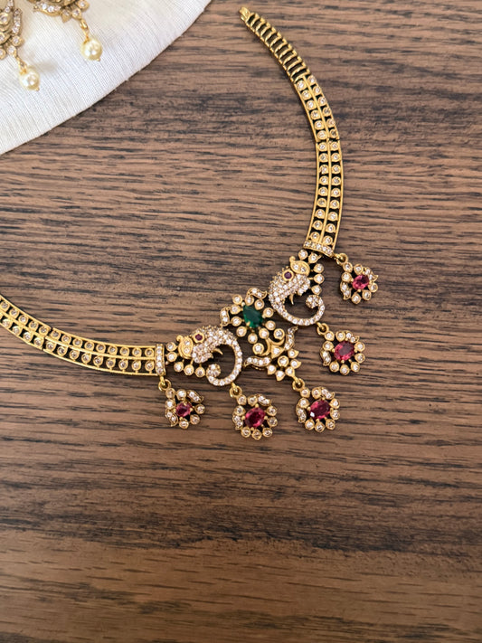 Antique Gold Finish Peacock Motif Kanti Choker Set with Ruby & Emerald Stones