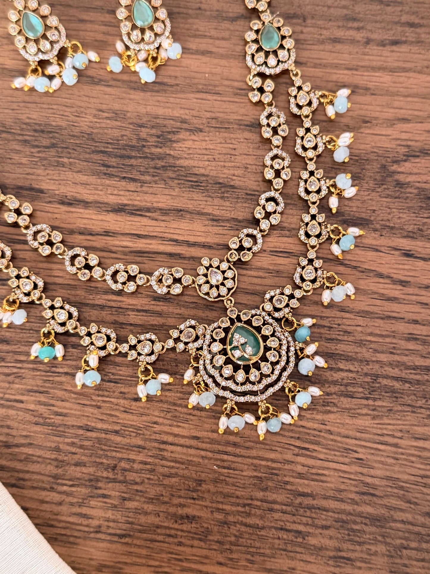 Exquisite Double-Layered CZ & Emerald Necklace with Seed Pearl Tassels