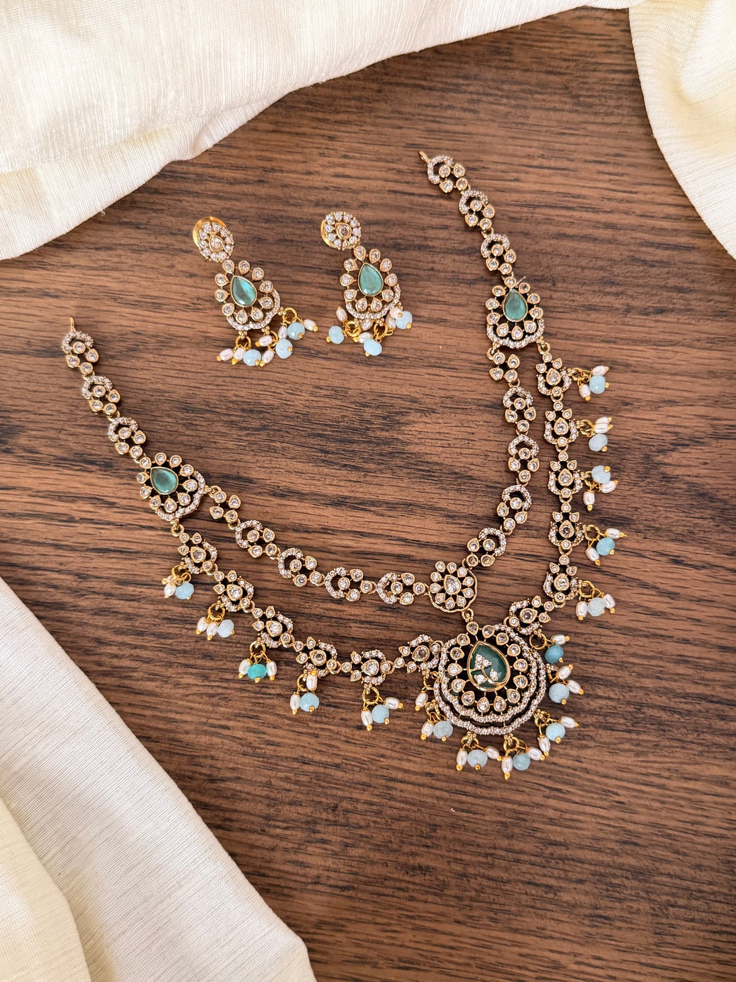 Exquisite Double-Layered CZ & Emerald Necklace with Seed Pearl Tassels