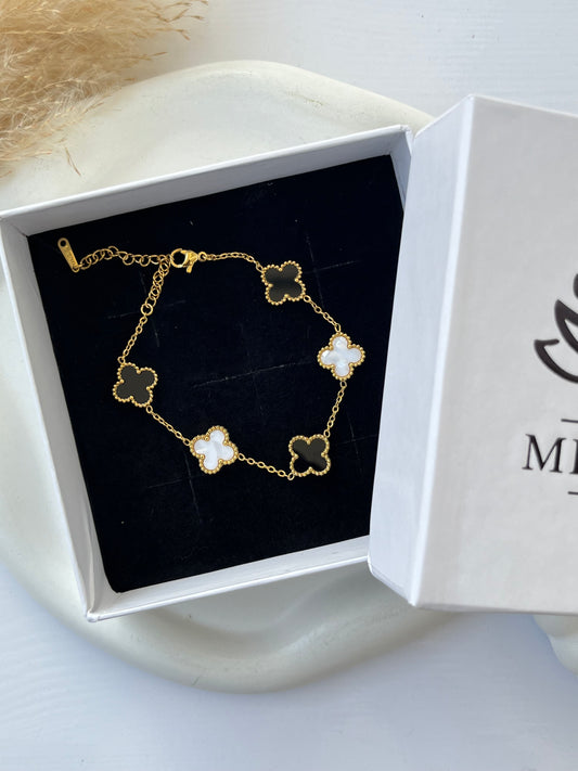 Elegant white and black clover bracelet for girls, featuring anti-tarnish finish and delicate gold chain — perfect for everyday wear or special occasions