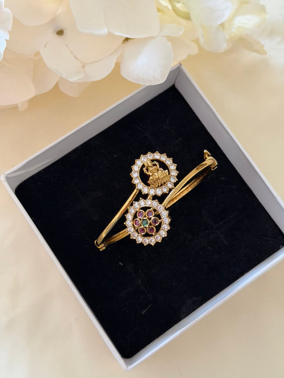 Lakshmi and Floral CZ Open Bypass Bracelet with Ruby and Emerald Centre