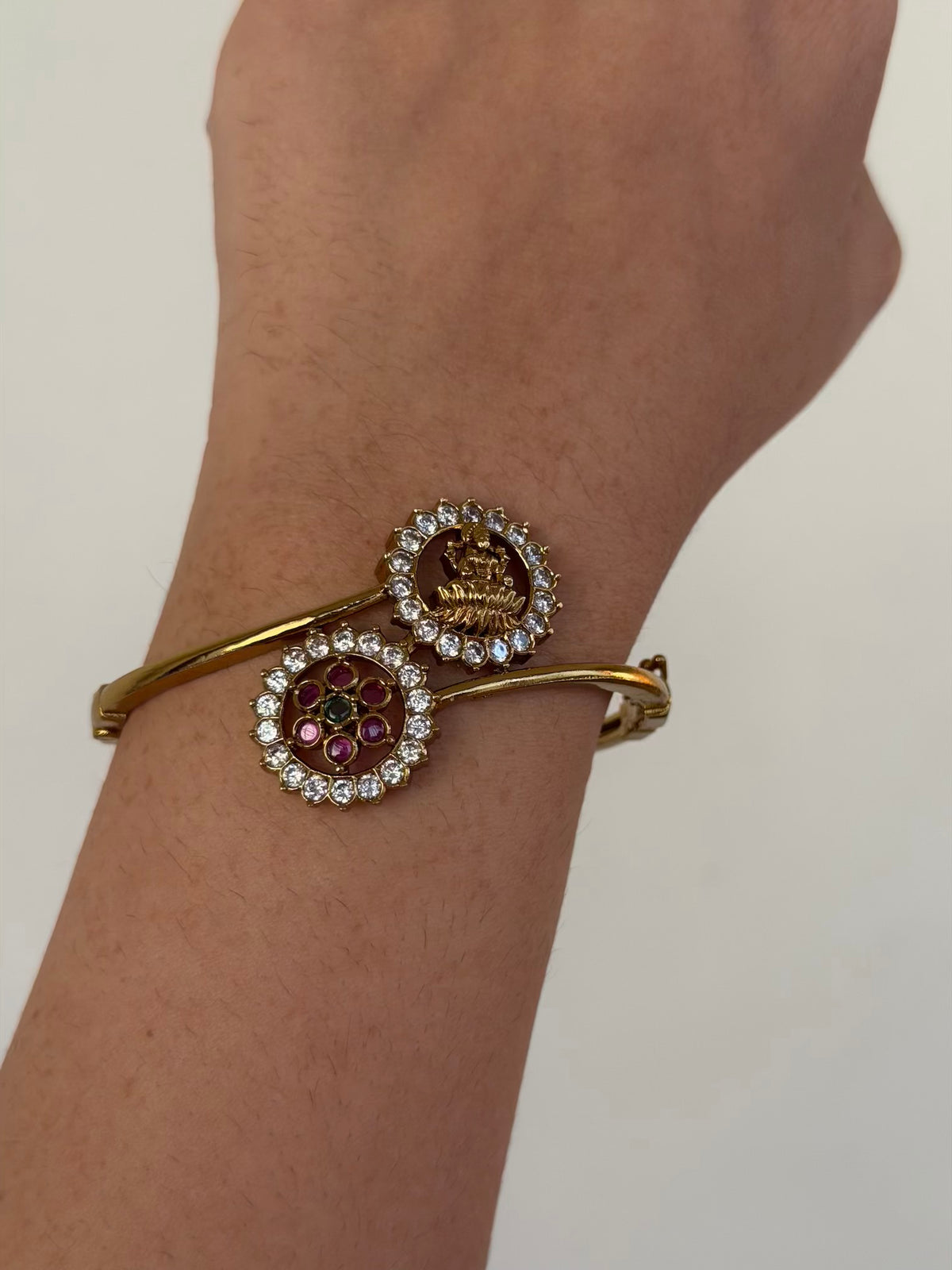 Lakshmi and Floral CZ Open Bypass Bracelet with Ruby and Emerald Centre
