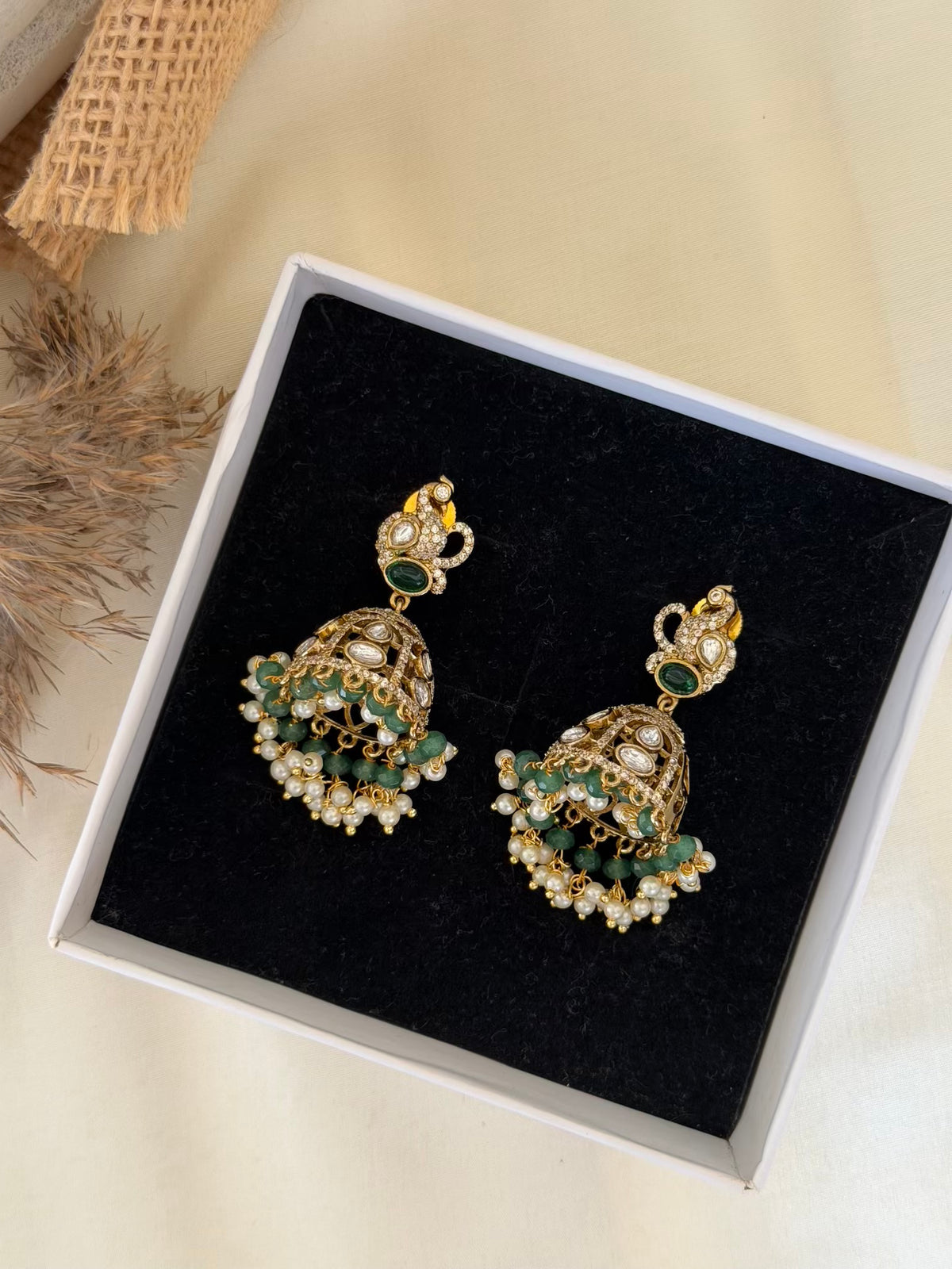 Kundan Peacock Stud Jhumka Earrings with Emerald Oval and Jade Beads