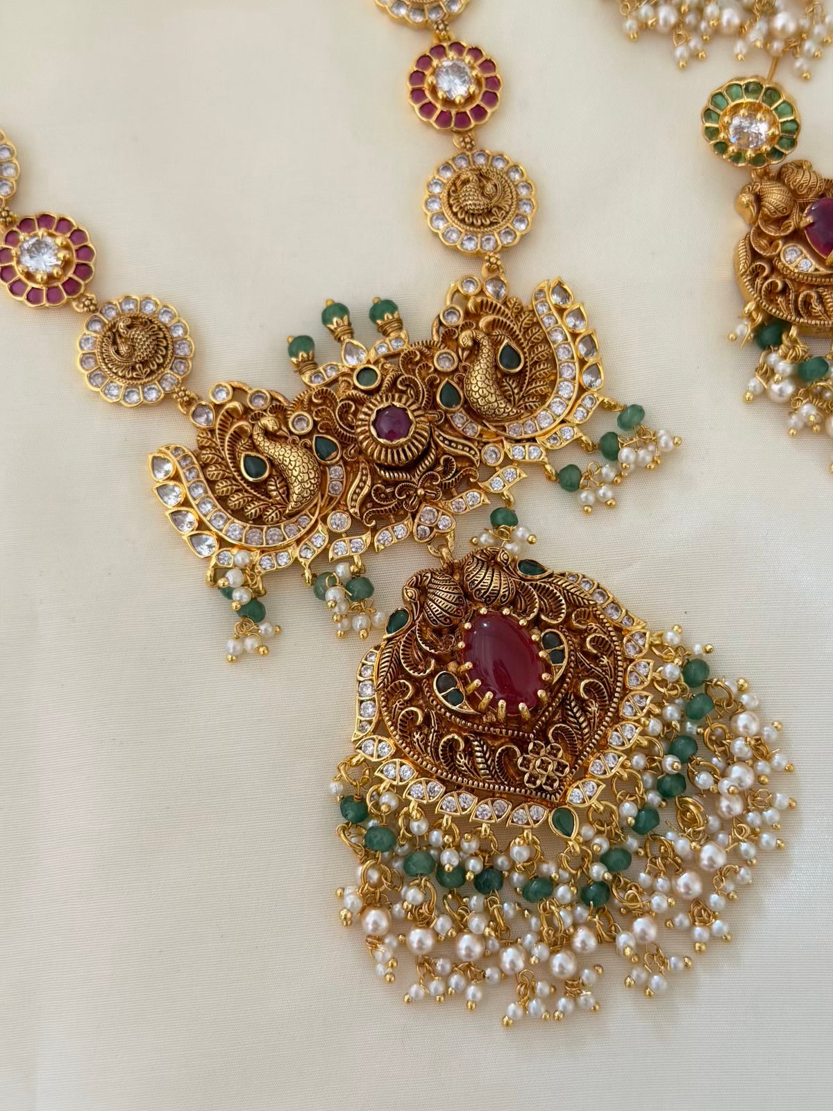 Nakshi Peacock Long Necklace Set with Ruby Centre Pendant, Pearl Drops and Earrings