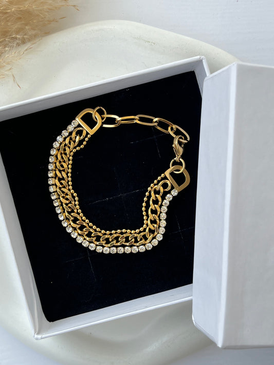 Triple-layer anti-tarnish bracelet with sparkling crystal stones, gold curb chain, and bead detailing – a glamorous yet versatile piece perfect for stylish daily wear or thoughtful gifting.