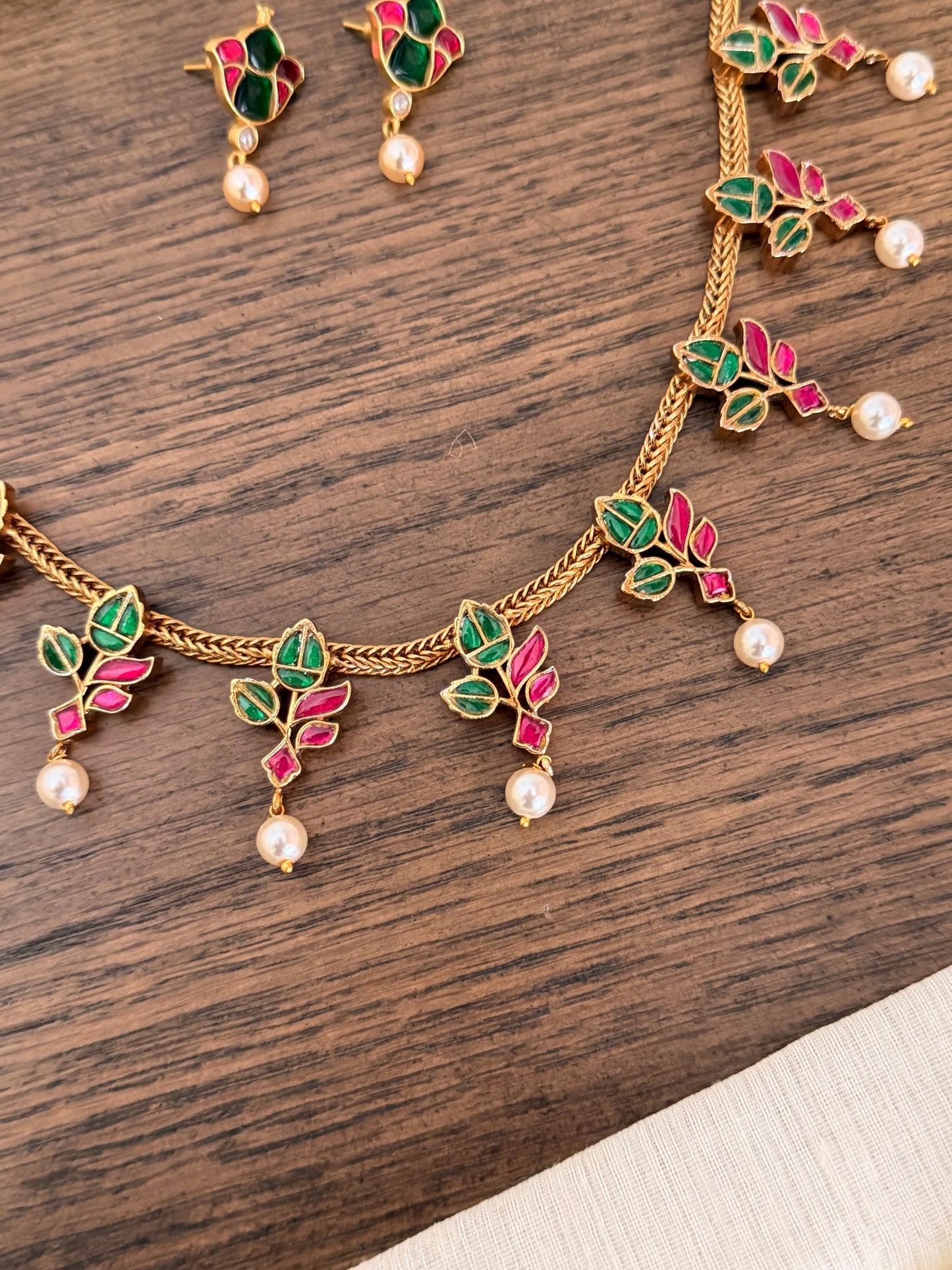Handcrafted Jadau Kundan Necklace Set with Emerald & Ruby Leaf Motifs
