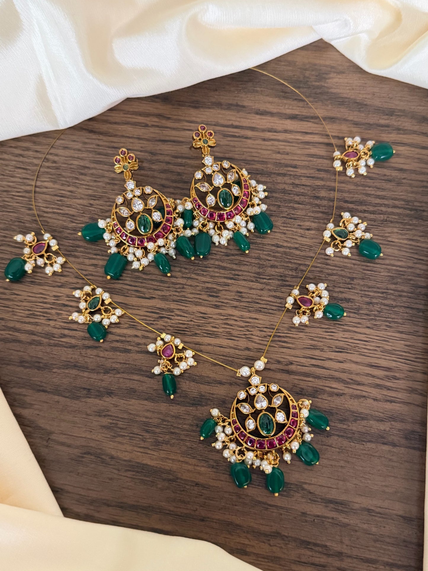 Majestic Chandbali Motif Invisible Chain Necklace Set with Emerald Beads