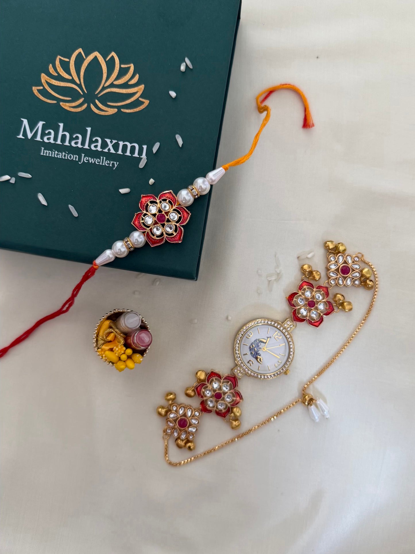 Red Kundan Rakhi & Peacock Dial Bracelet Watch Combo – Red & Green Floral