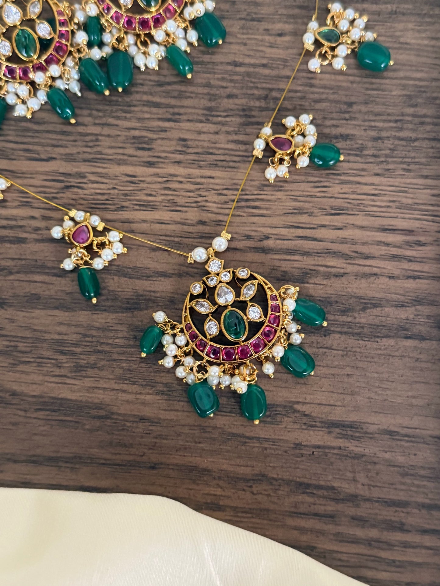Majestic Chandbali Motif Invisible Chain Necklace Set with Emerald Beads