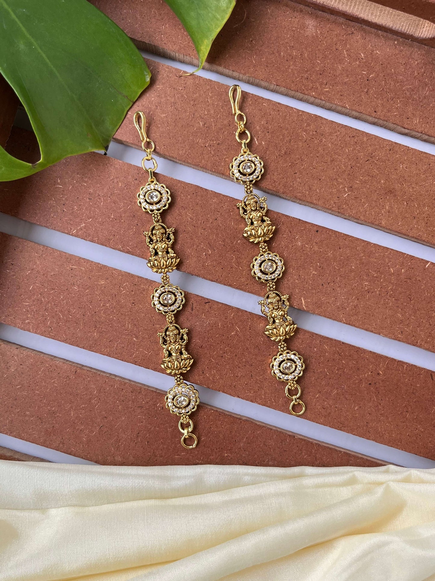 Lakshmi Devi Studded Mattal with Emerald Green Stones – Unique Design