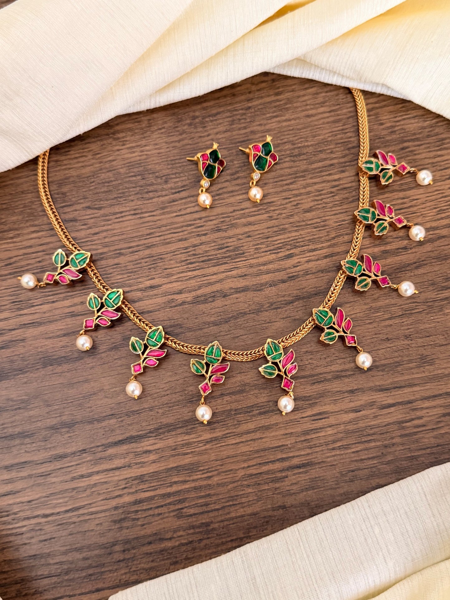 Handcrafted Jadau Kundan Necklace Set with Emerald & Ruby Leaf Motifs