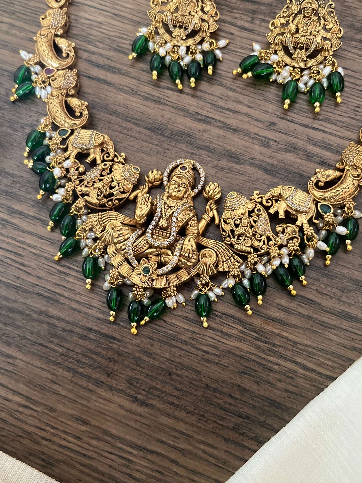 3D Grand Lakshmi Devi Antique Gold Necklace Set with Temple Design & Green Beads