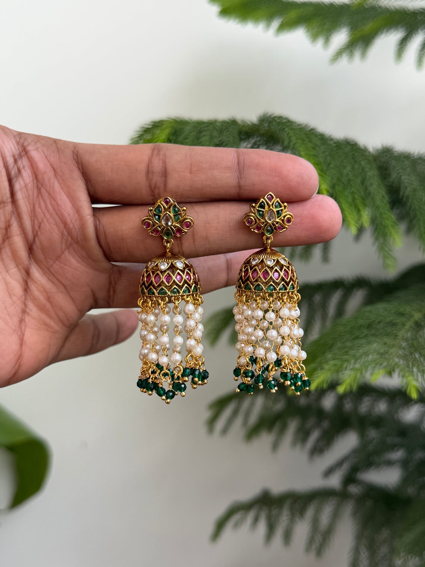 Traditional Kemp Stone Jhumkas with Pearl & Emerald Drops (Matte Gold Finish)