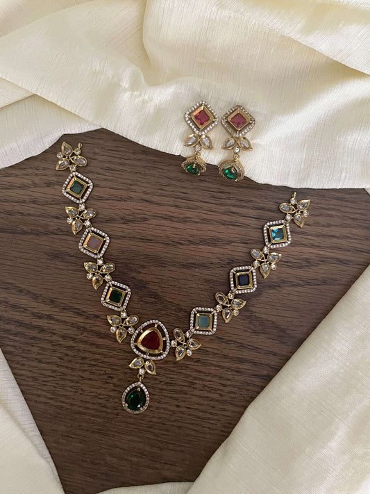 Multicolor gold-finish necklace set with square & teardrop stones and matching festive earrings – traditional jewellery flatlay