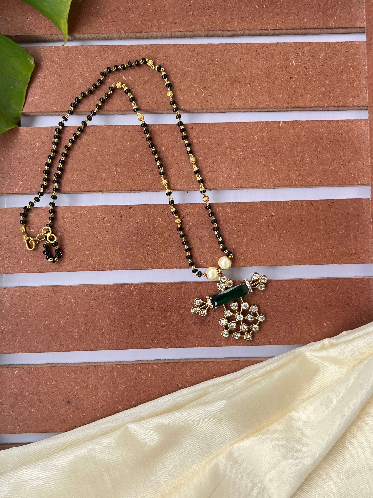 Studded Design Medium Length Mangalsutra with Green Stone Pendant