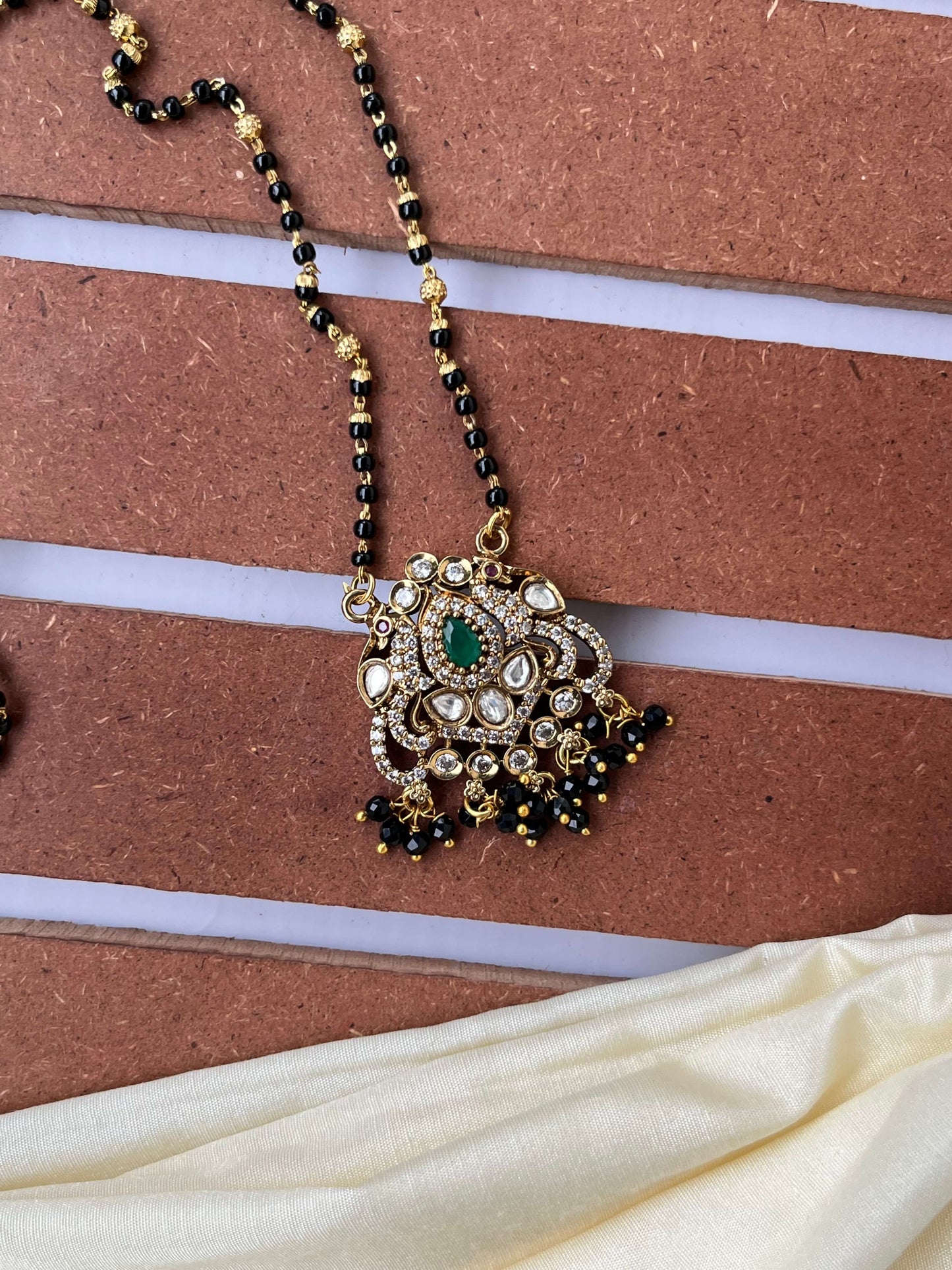 Medium Length Kundan Mangalsutra with Red & Green Stone Variants