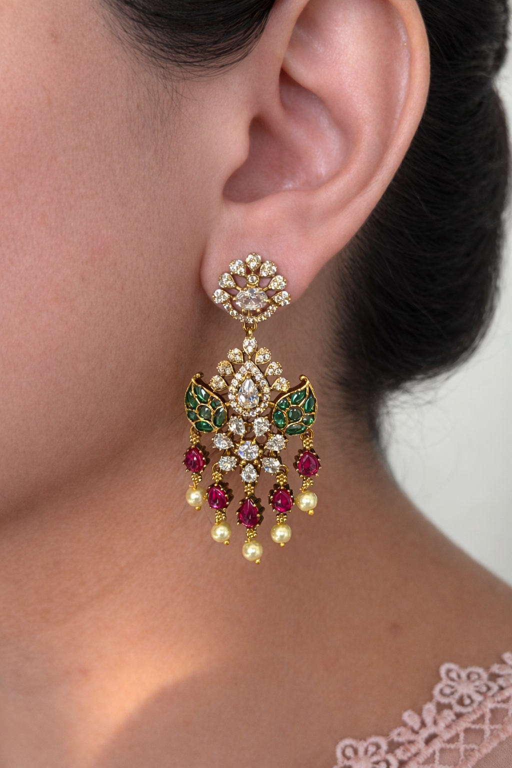 Luxury Diamond look alike earrings worn by a person in neutral background