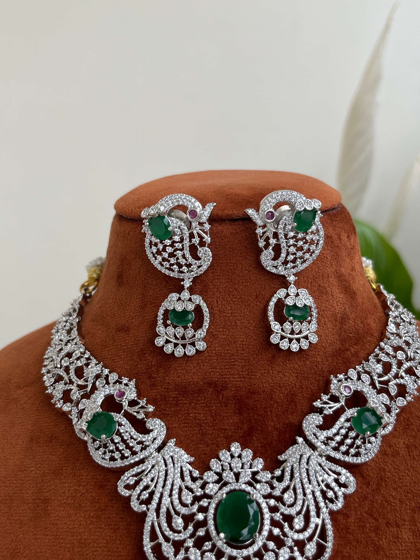 Silver Finish Peacock Design Necklace Set with Emerald Green Stones