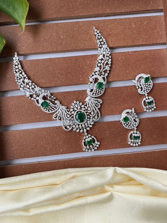 Silver Finish Peacock Design Necklace Set with Emerald Green Stones